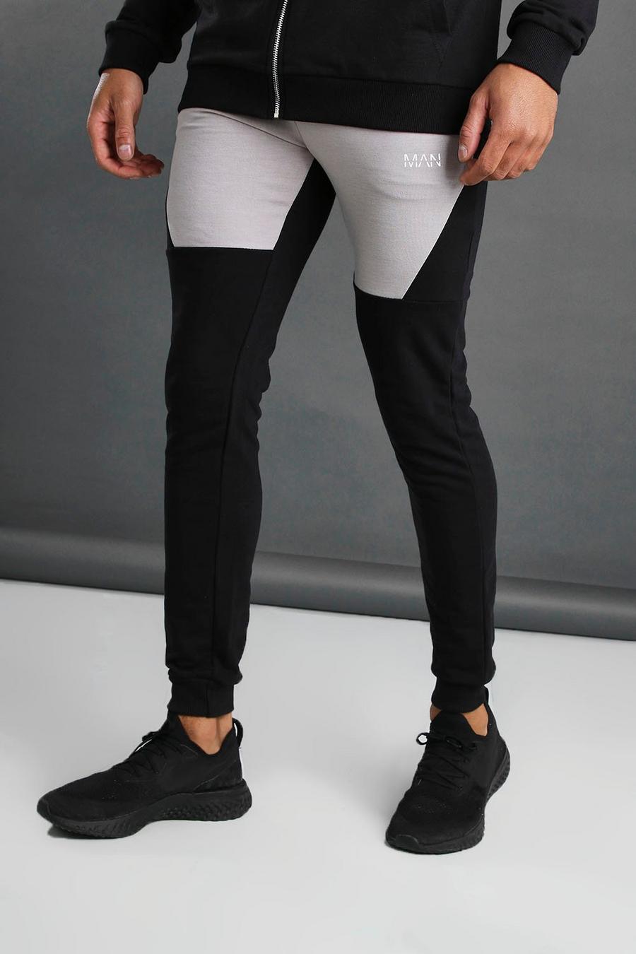 MAN Tapered Fit Colour Block Joggers image number 1
