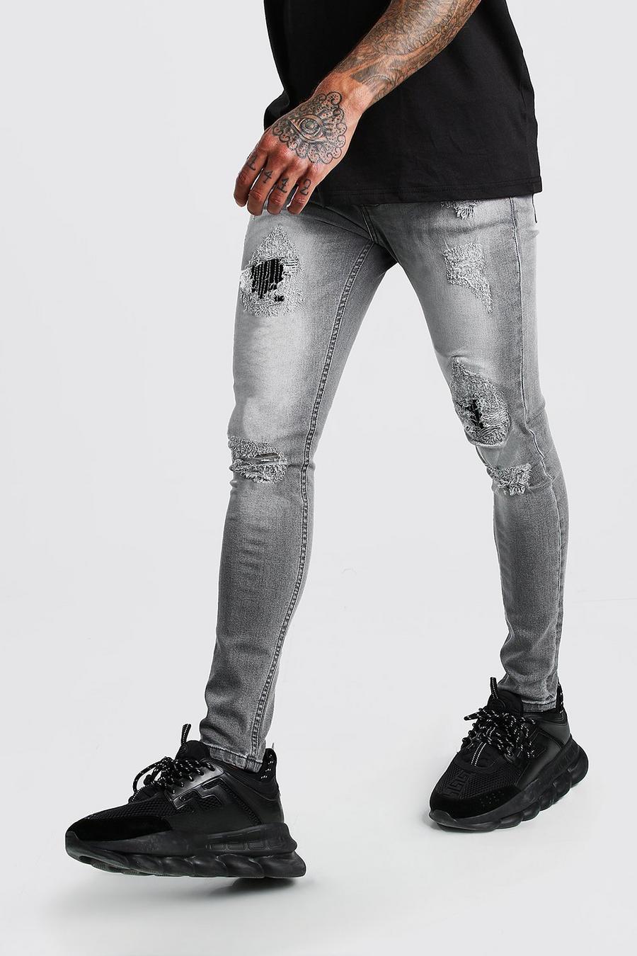 Super skinny jeans med slitage och lagningar image number 1