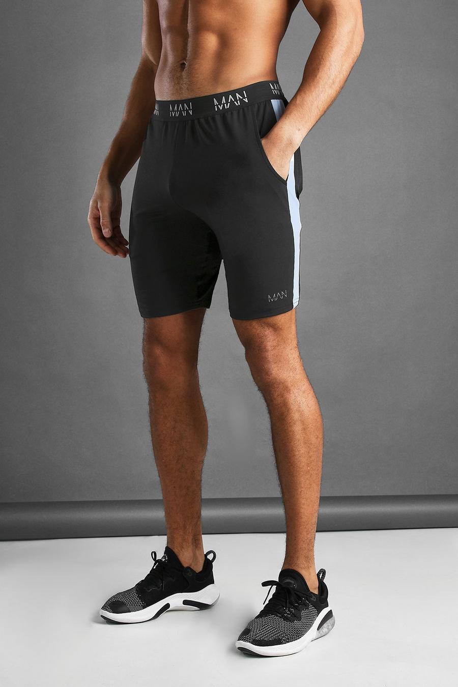 Mittellange Active Shorts mit „MAN“-Print image number 1