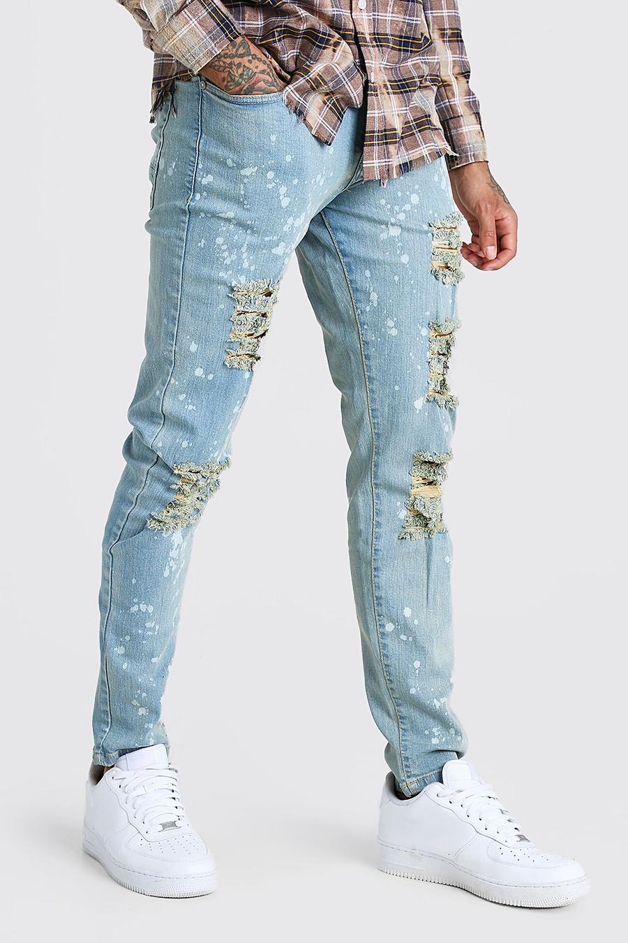 Skinny jeans med slitage och blekt effekt image number 1