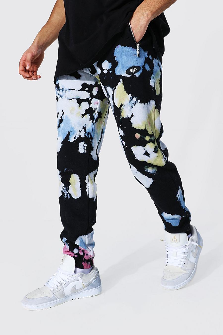 Pantaloni tuta regular effetto tie-dye con cerniera e stampa Official MAN, Nero image number 1