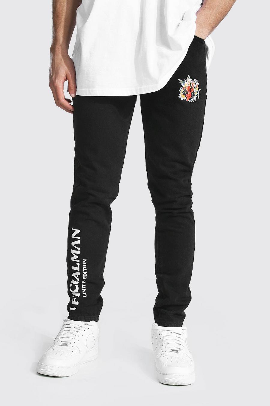 שחור דהוי ג'ינס סקיני קשיח עם הדפס פרח וכיתוב Man image number 1