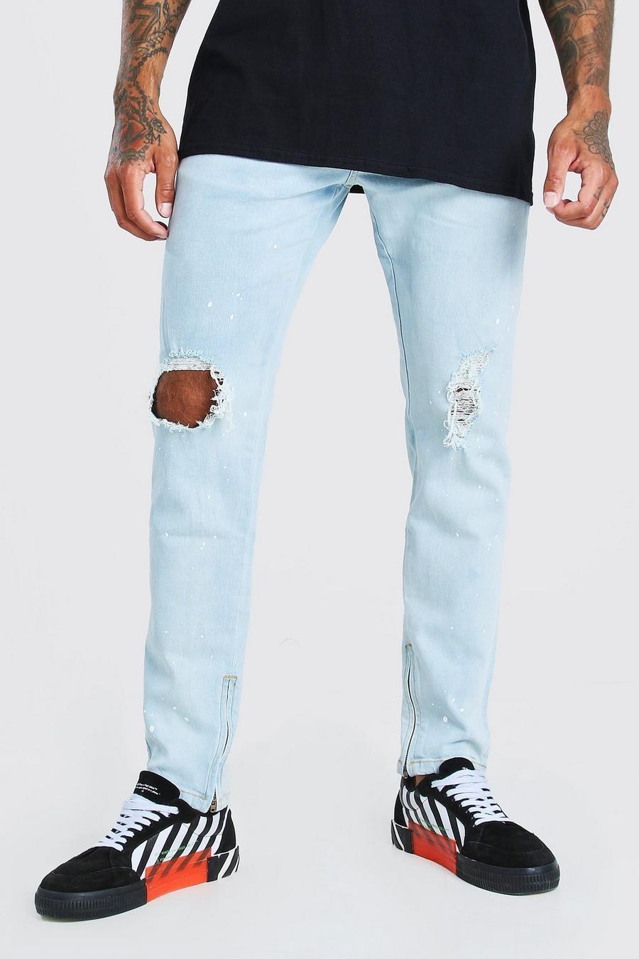 Ice blue Skinny jeans med slitna knän, färgstänk och dragkedjor image number 1