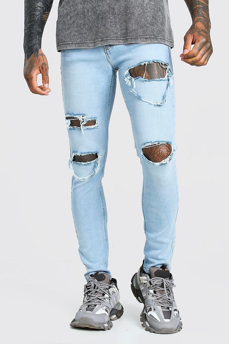 סקיני ג'ינס נמתח עם מספר קרעים image number 1