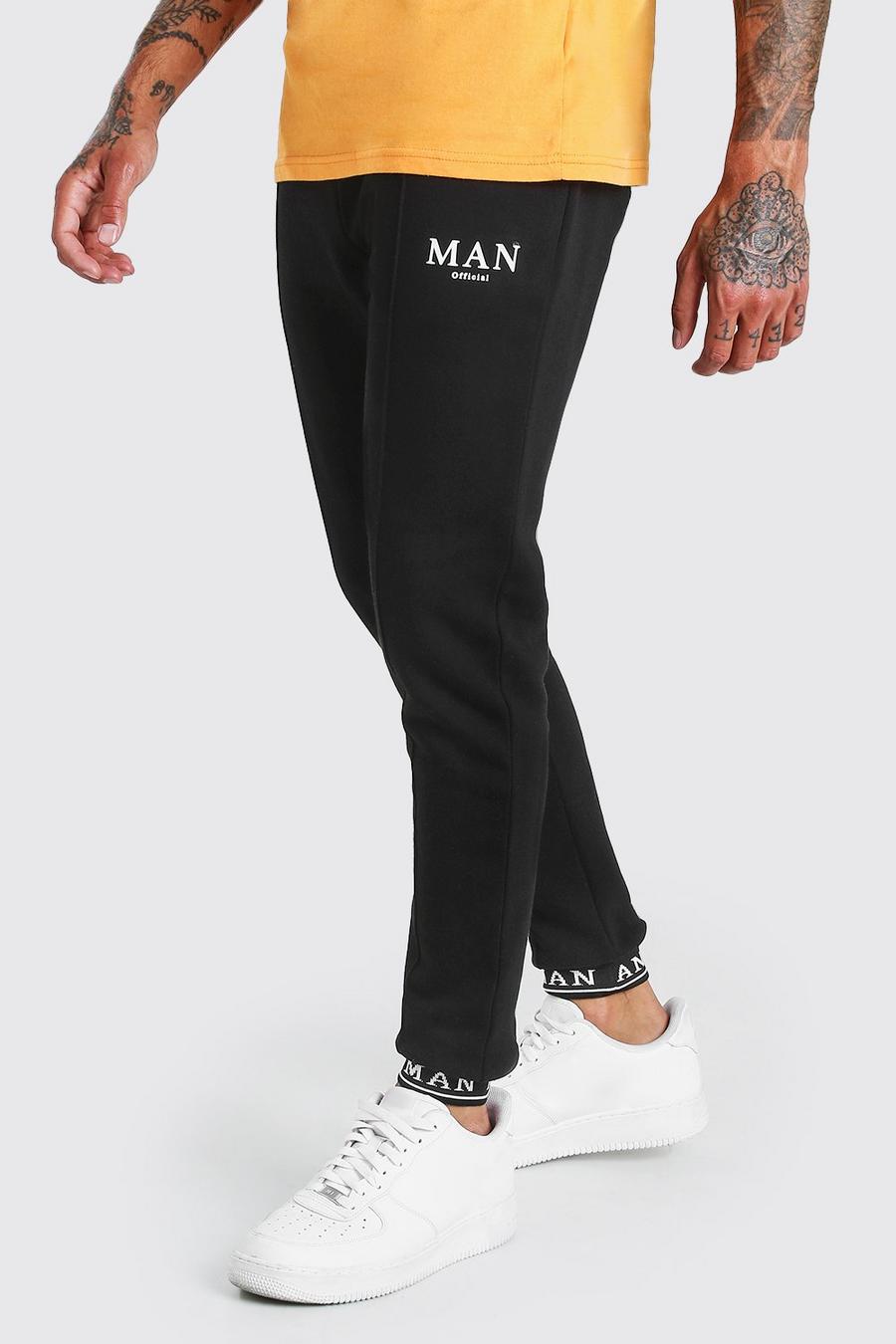 Pantaloni tuta skinny MAN con nervature e risvolti ricamati image number 1