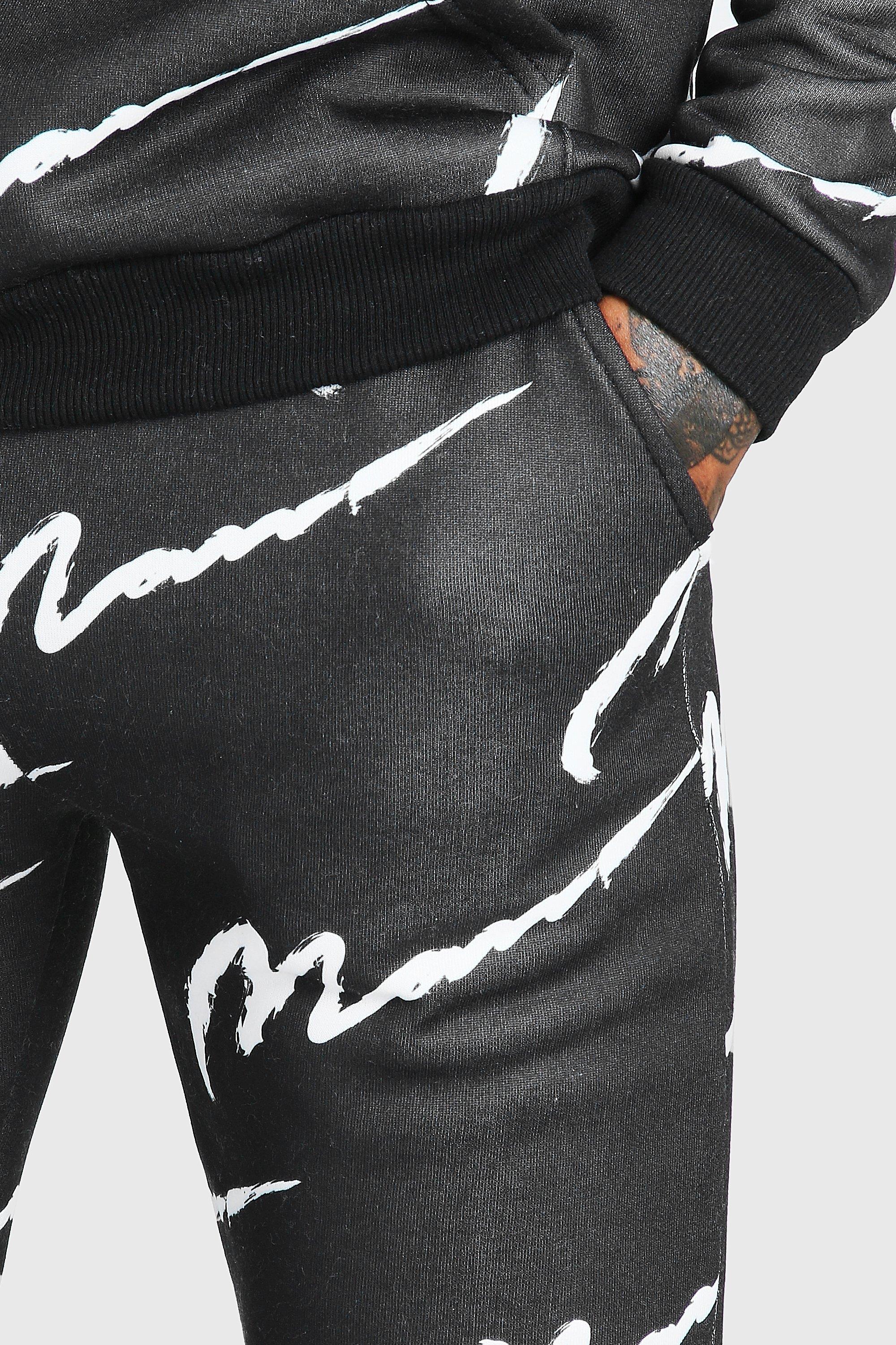 All over man printed hooded tracksuit black store