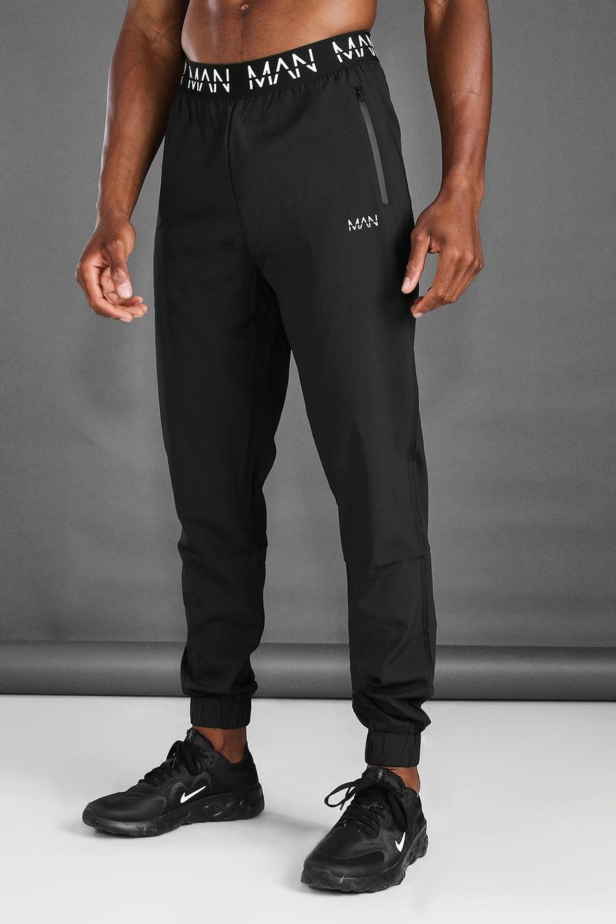 שחור negro מכנסי ריצה לאימונים בגזרת קרסול צרה עם חגורה של MAN