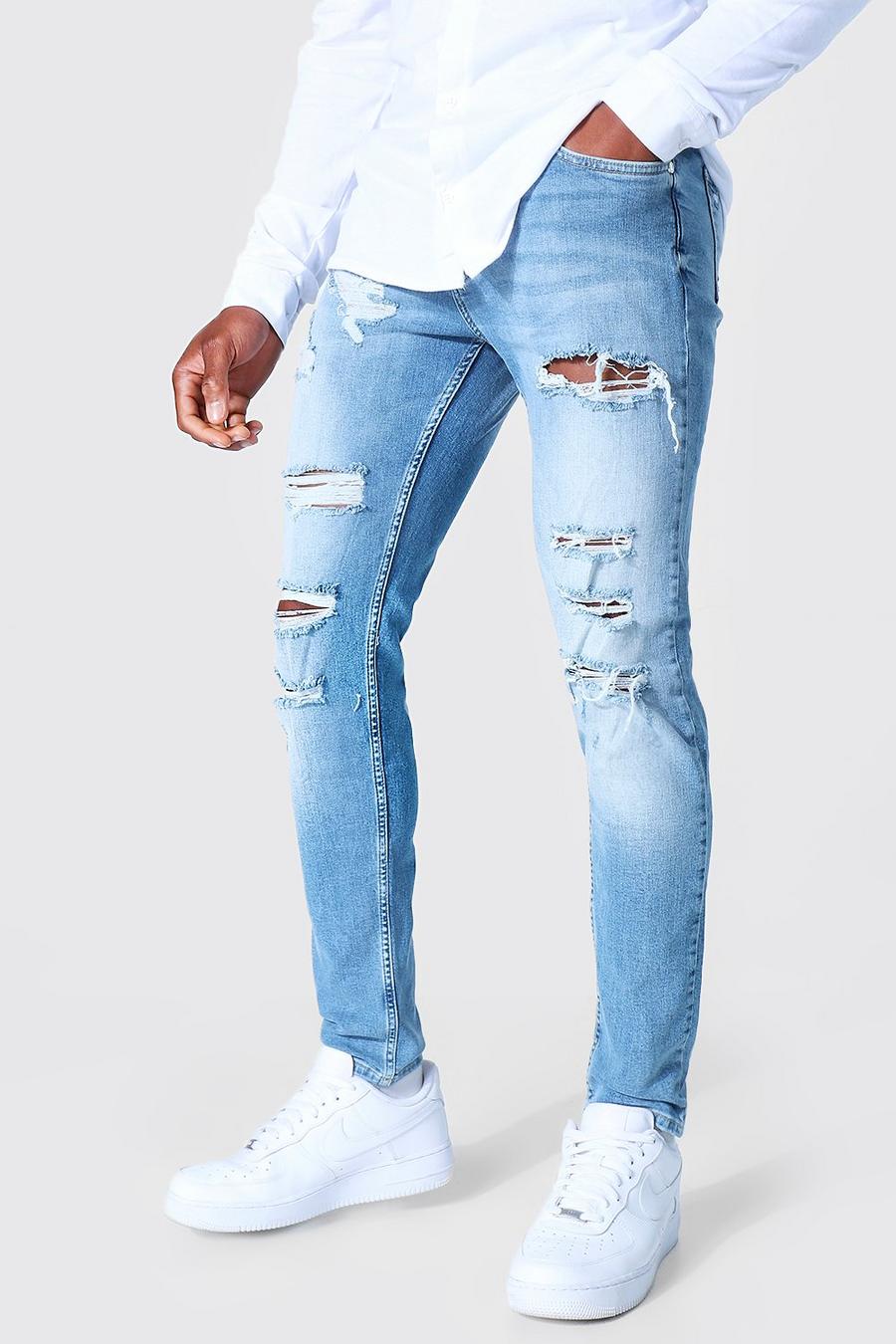 Mid blue Skinny jeans med stretch och slitna knän image number 1