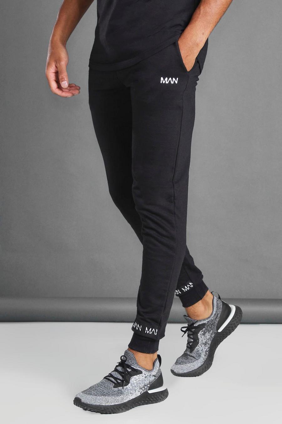Pantalones de correr con bajos de cinta MAN, Negro image number 1