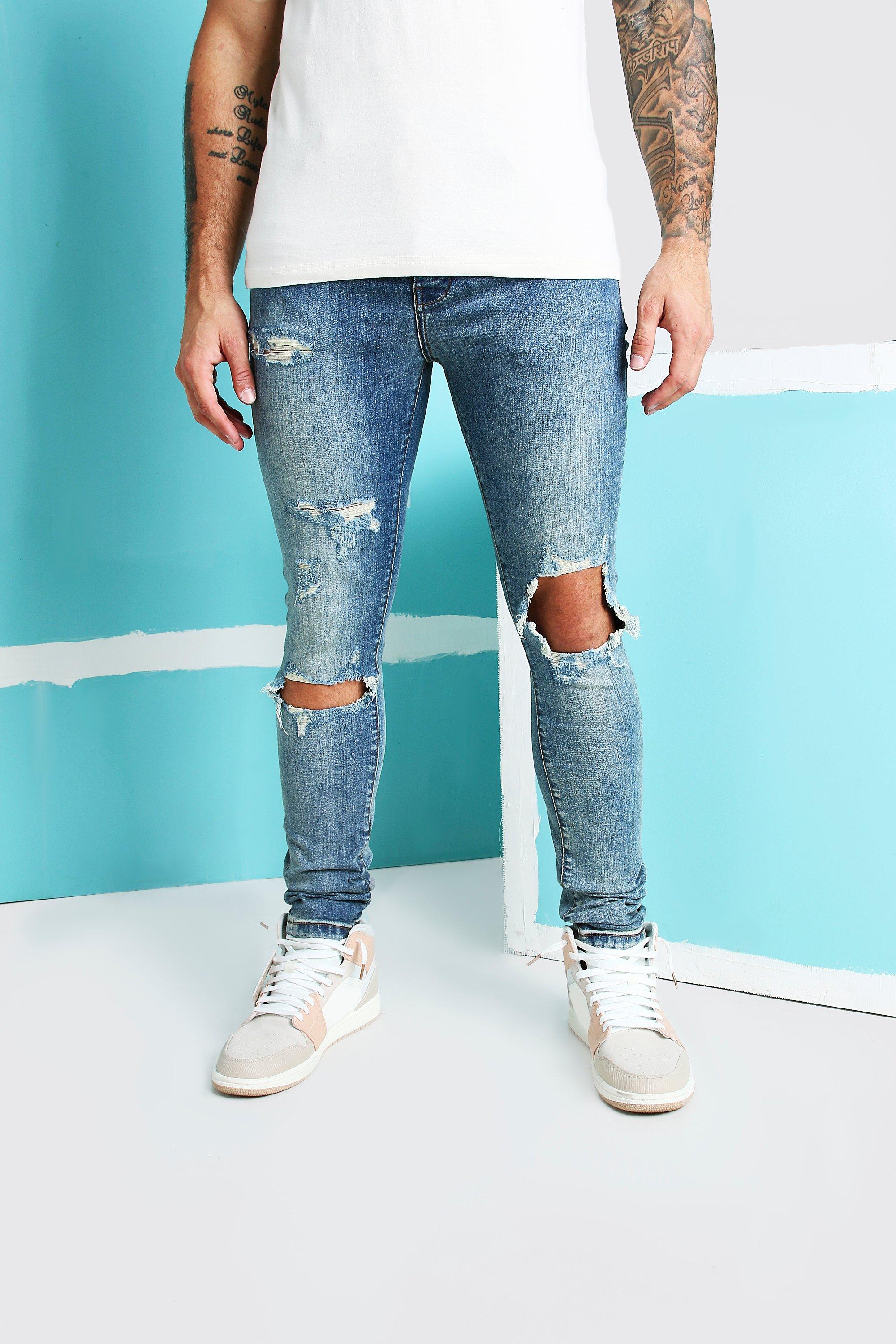 blue ripped knee jeans