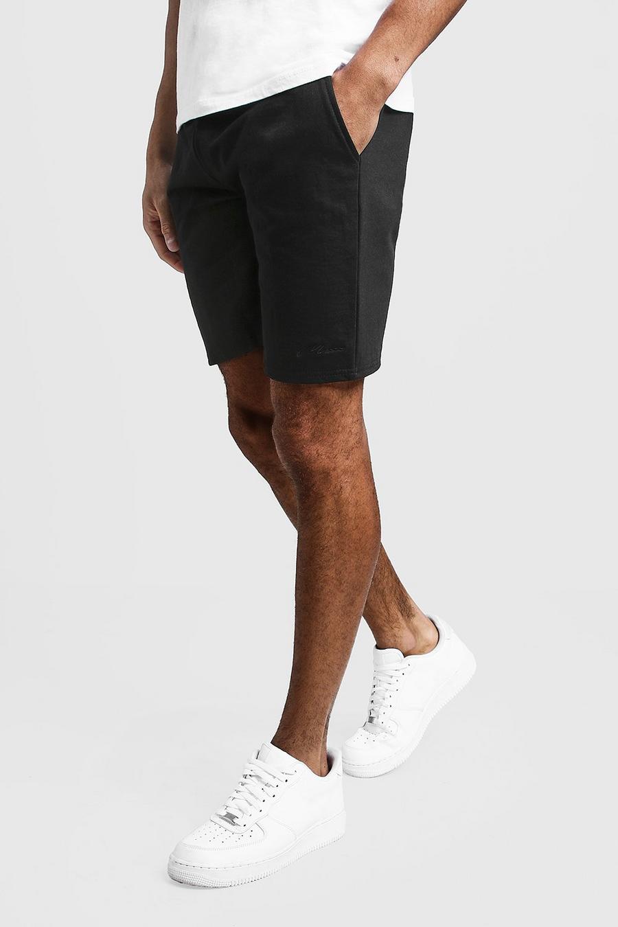 Black MAN Signature Mid Length Jersey Shorts image number 1