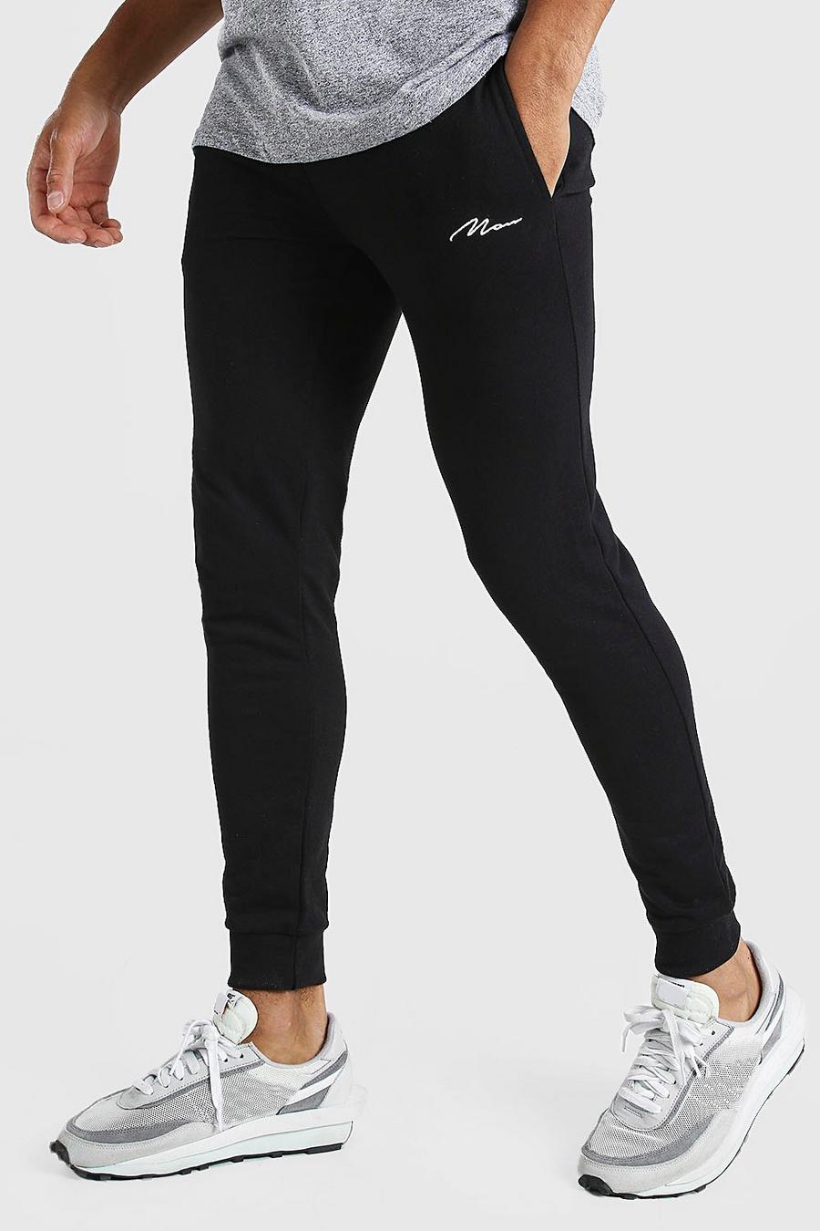שחור מכנסי ריצה בגזרת סופר סקיני עם חתימת MAN image number 1
