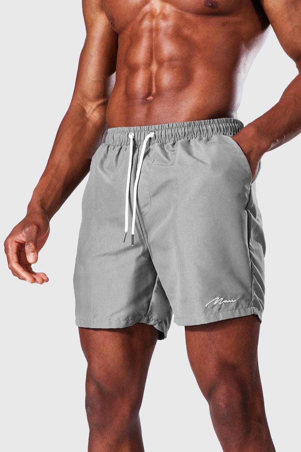 Man Signature Mid Length Swim Shorts boohoo IE
