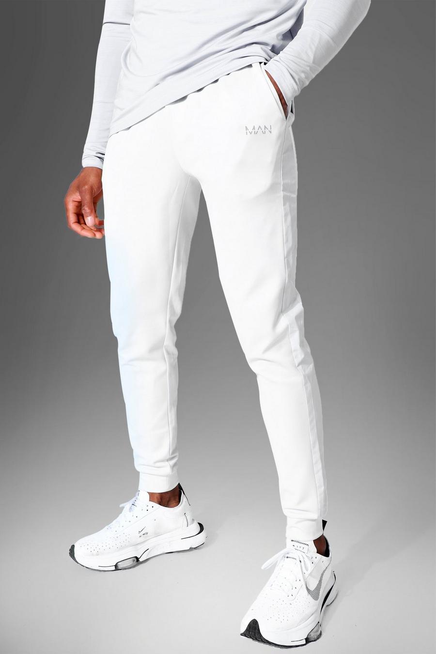 אפור מכנסי ריצה ספורטיביים עם עיטור בצבע מנוגד וכיתוב Man image number 1