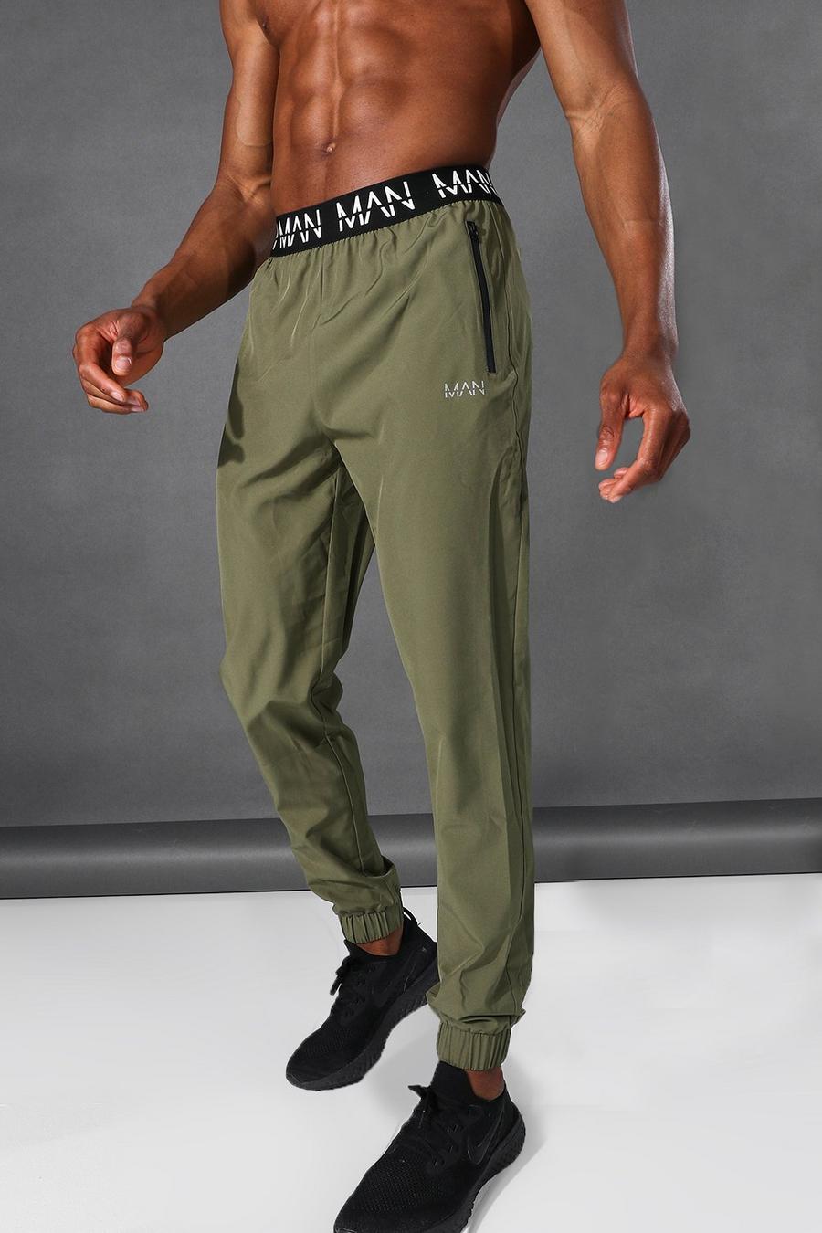 Pantaloni tuta affusolati Man Active con fascia in vita con logo, Khaki image number 1