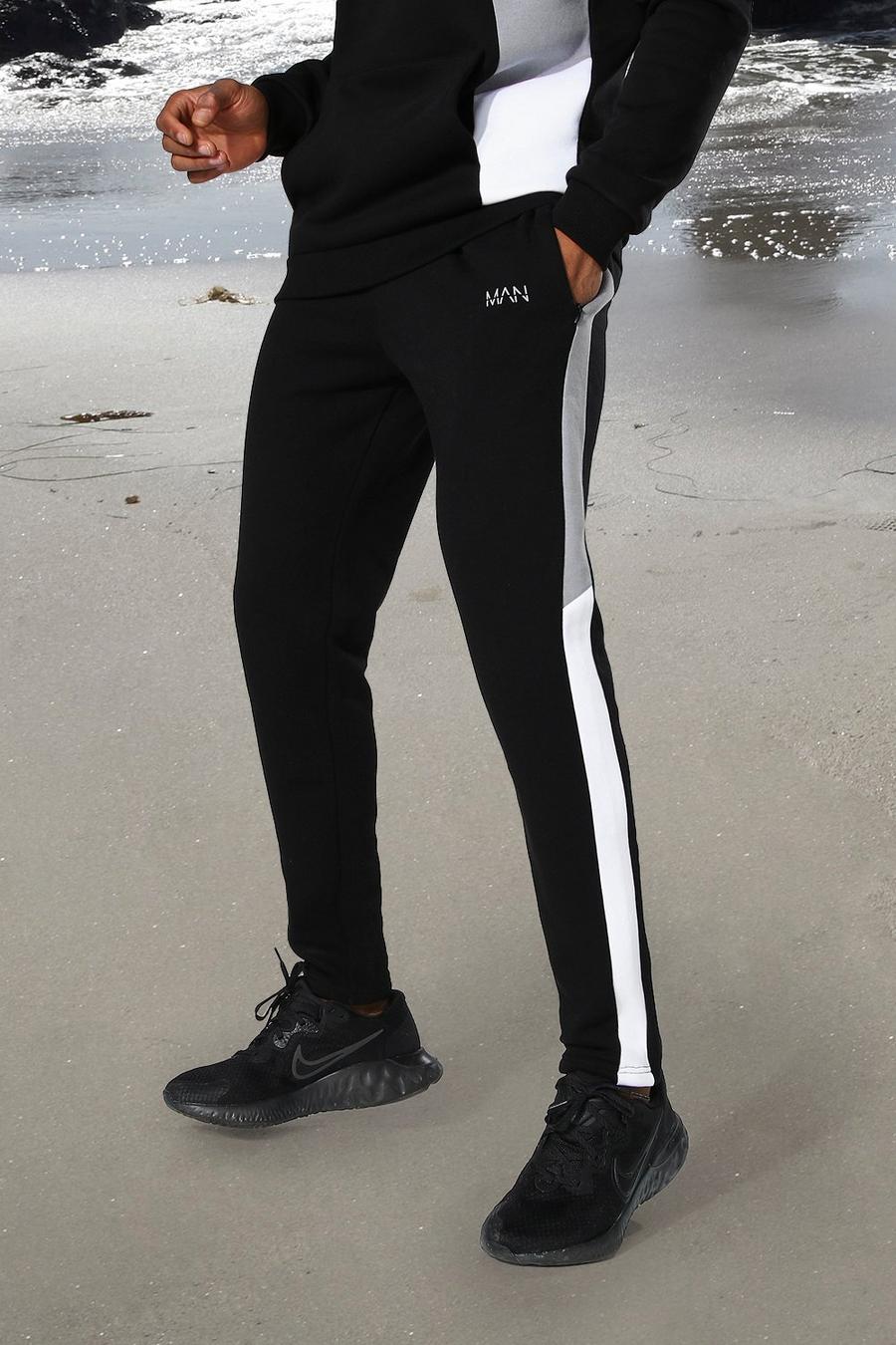 Black MAN Active Joggers i skinny fit med blockfärger image number 1
