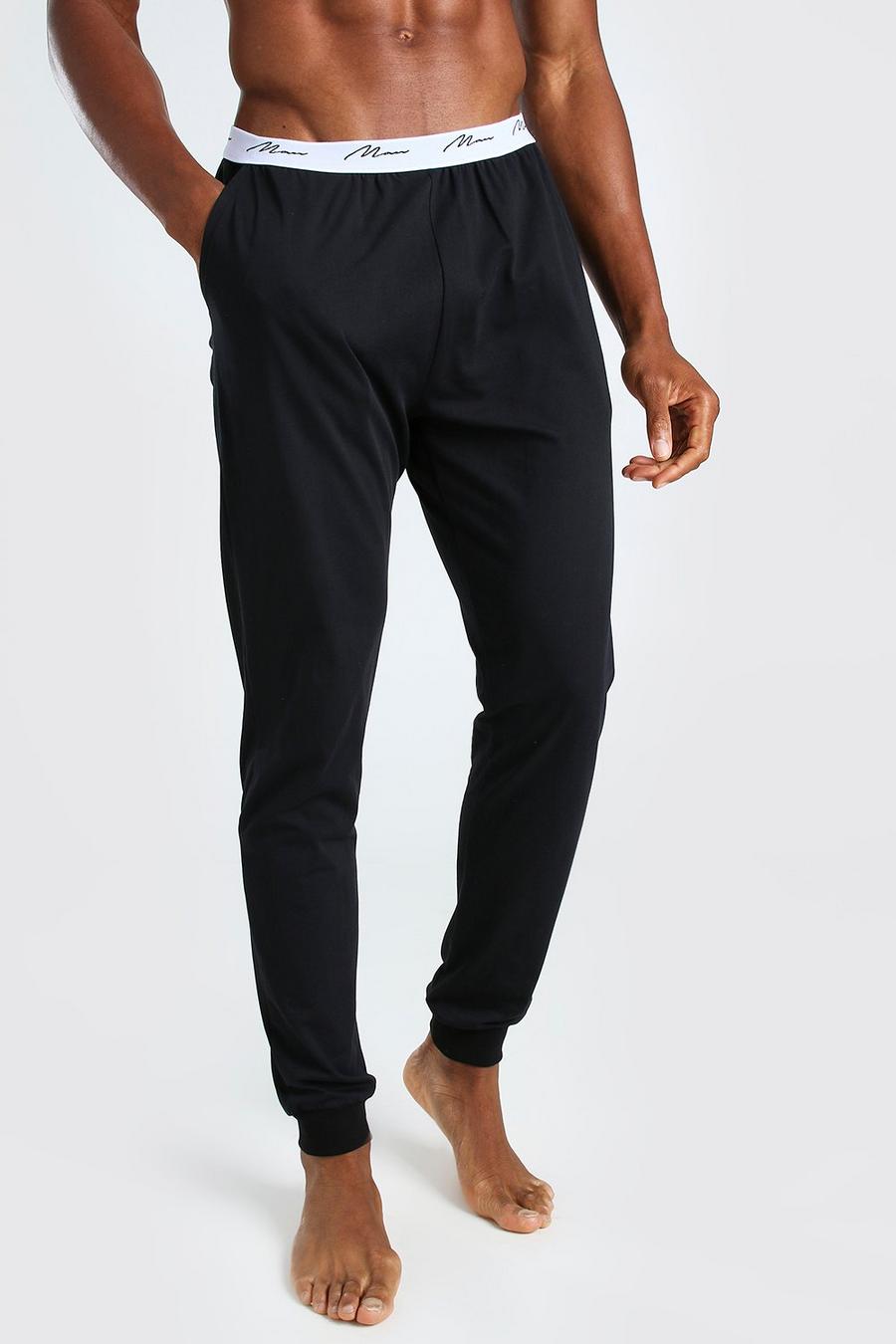 Pantalones de correr cómodos de jacquard con cinturilla de la firma MAN, Negro image number 1