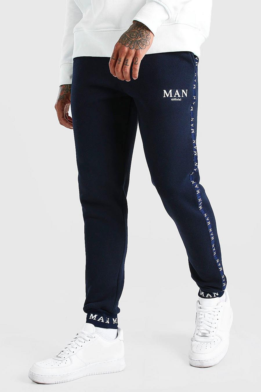 Pantaloni tuta con fascia in vita con scritta MAN ricamata e fascia laterale image number 1