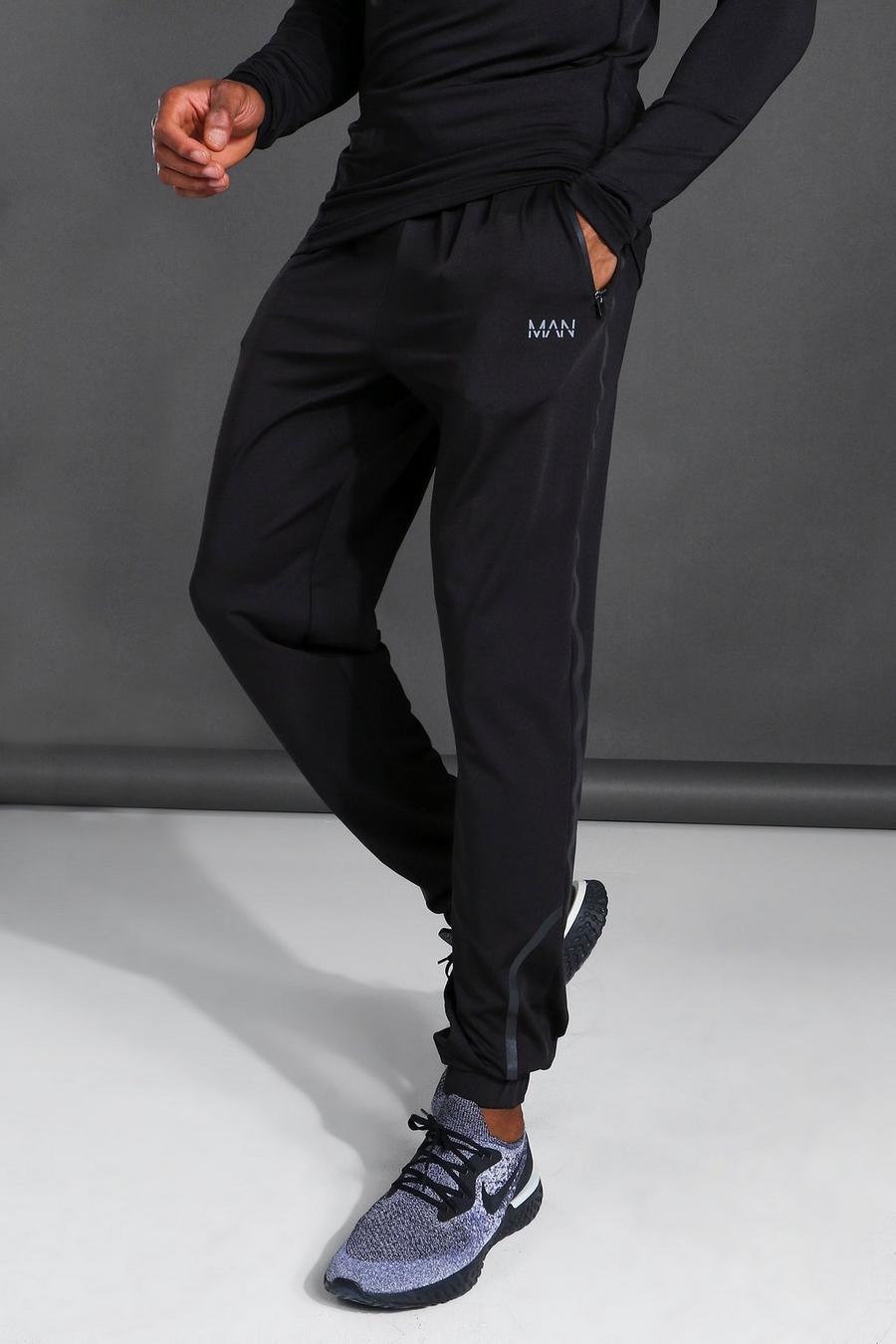 Black Man Active Skinny Fit Joggingbroek Met Reflecterend Detail image number 1