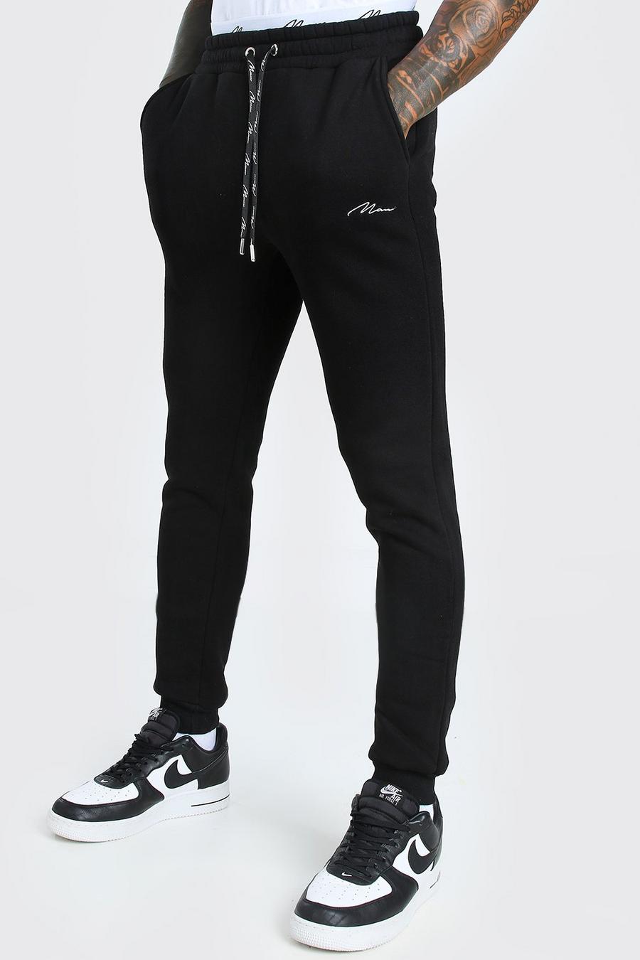 Pantaloni tuta skinny con doppio elastico in vita e firma MAN, Nero image number 1