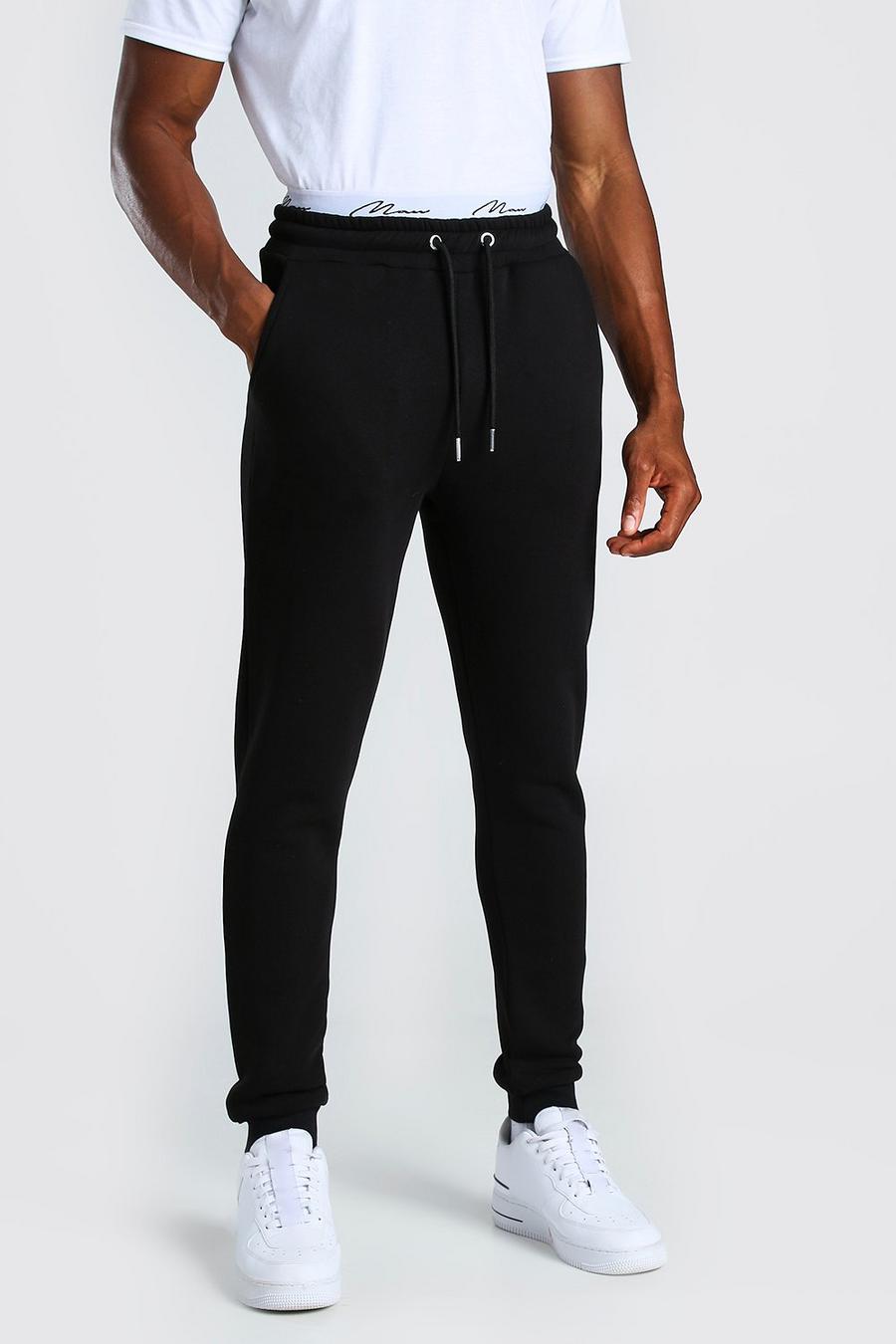 Pantalones de correr skinny con cintura bordada MAN Signature, Negro image number 1