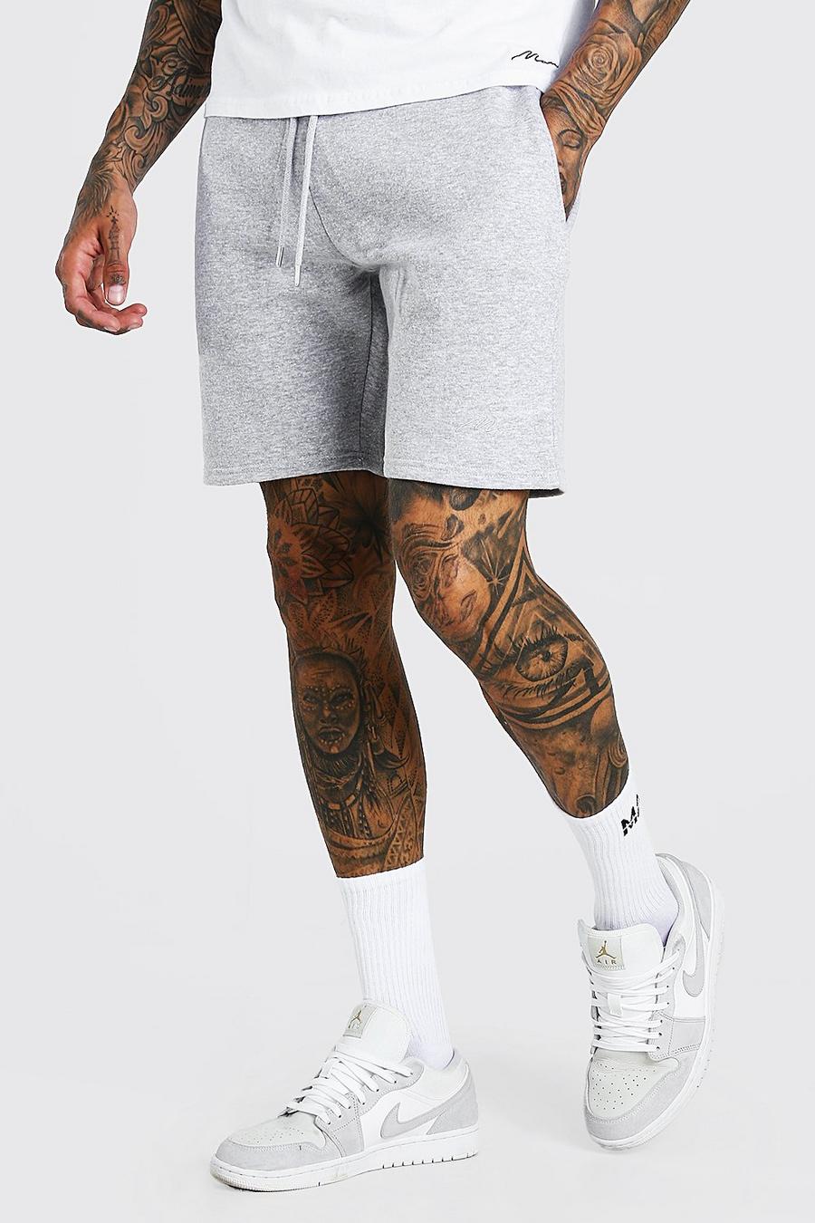 Pantaloncini in jersey di media lunghezza con scritta MAN image number 1