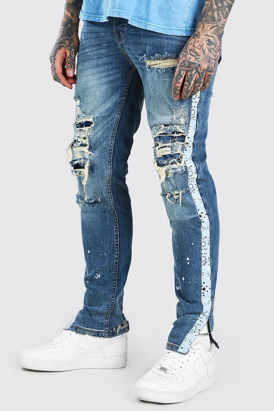 כחול ביניים מכנסי סקיני ג'ינס עם קרעים בכל מקום ואפקט הלבנה image number 1