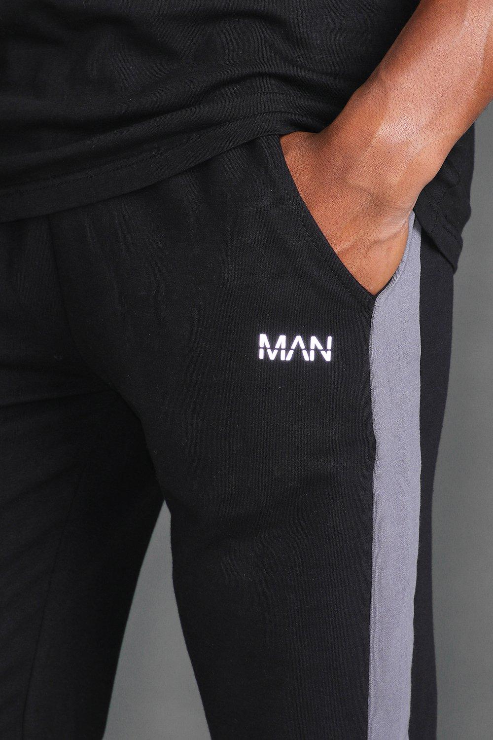 Pantalones de deporte con franjas laterales Skinny activos MAN | boohoo