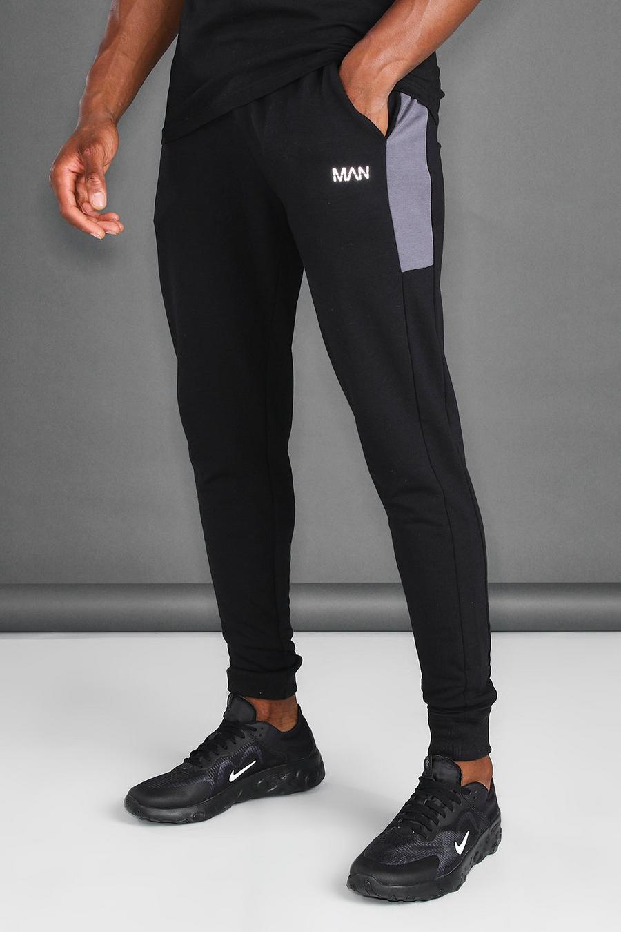 Pantalones de deporte Skinny con paneles laterales MAN Active, Negro image number 1