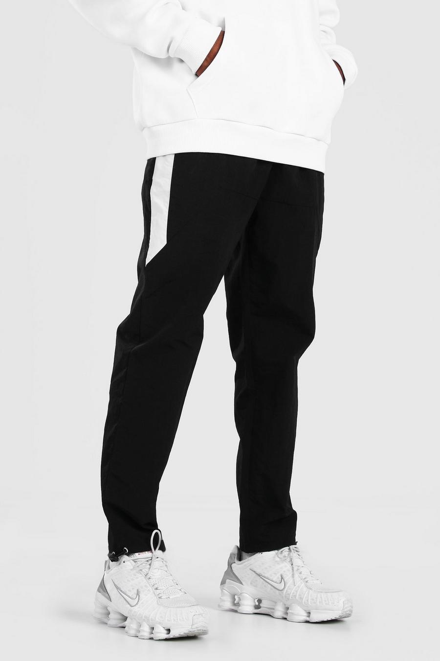 שחור מכנסיים מבד עם קמטים ופאנלים קולור בלוק בצדדים image number 1