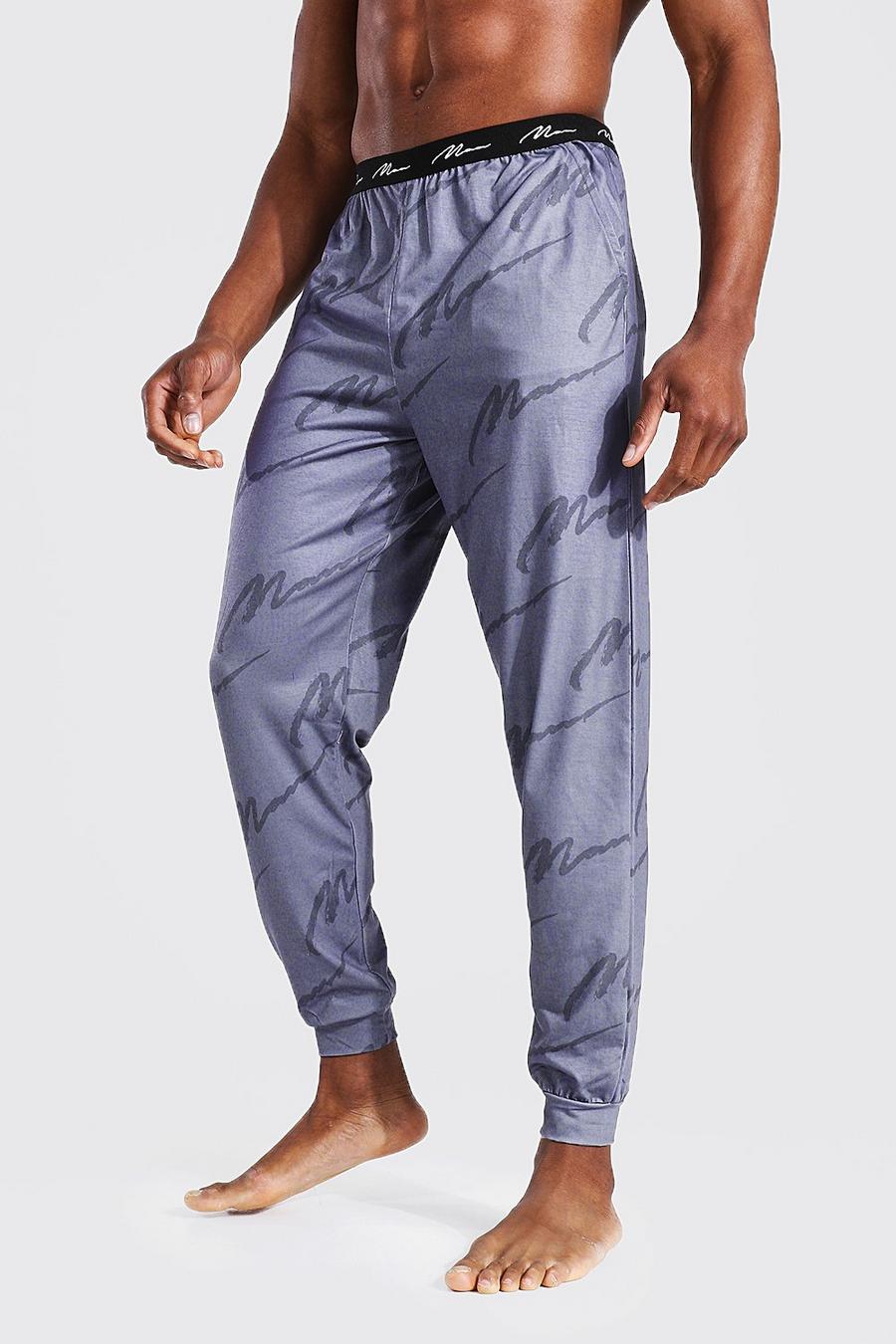 Pantalones de deporte cómodos con estampado tonal e inscripción MAN, Gris image number 1