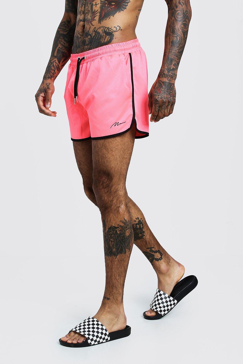 neon pink swim shorts