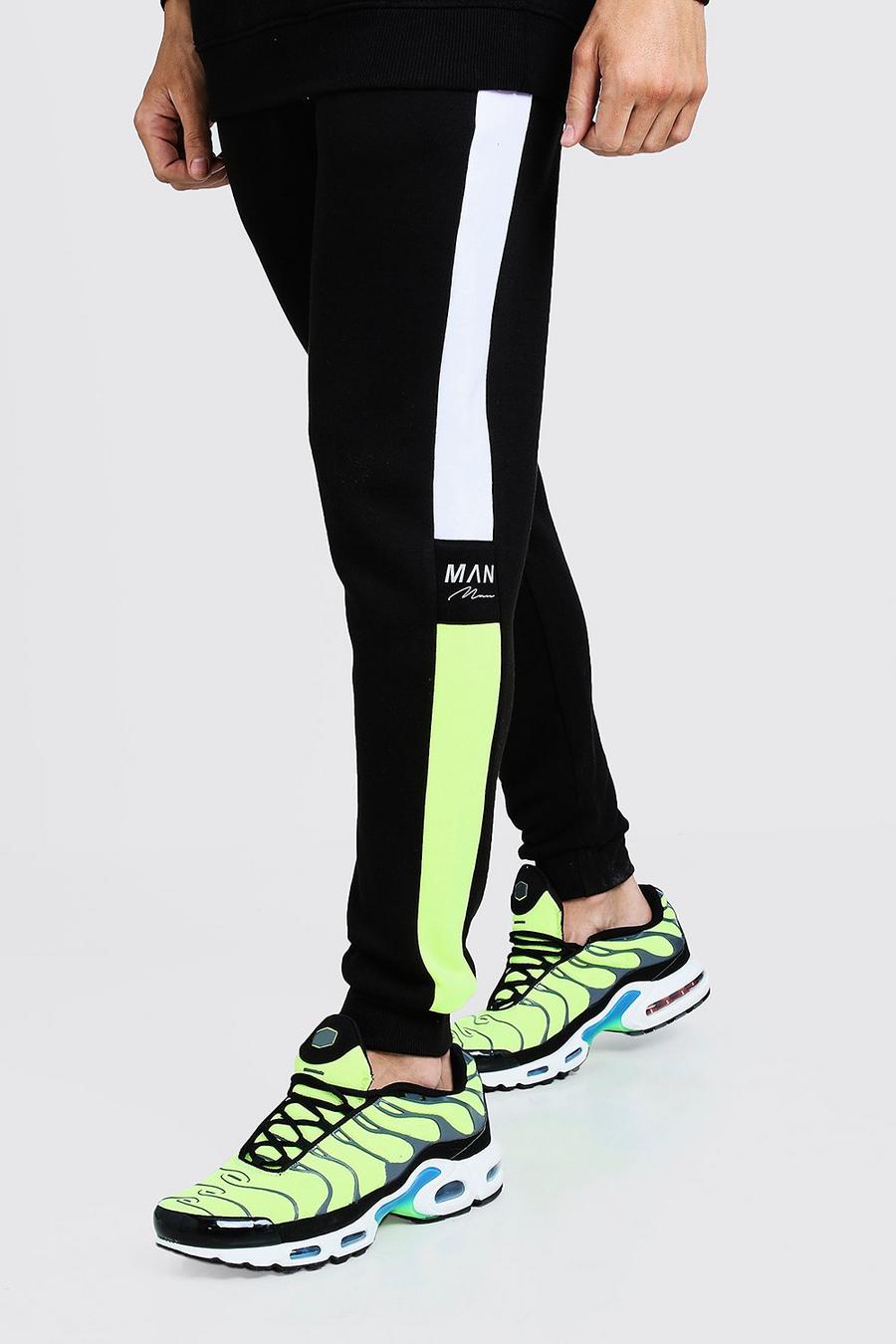 Skinny Jogginghosen von MAN mit reflektierendem Seiteneinsatz image number 1
