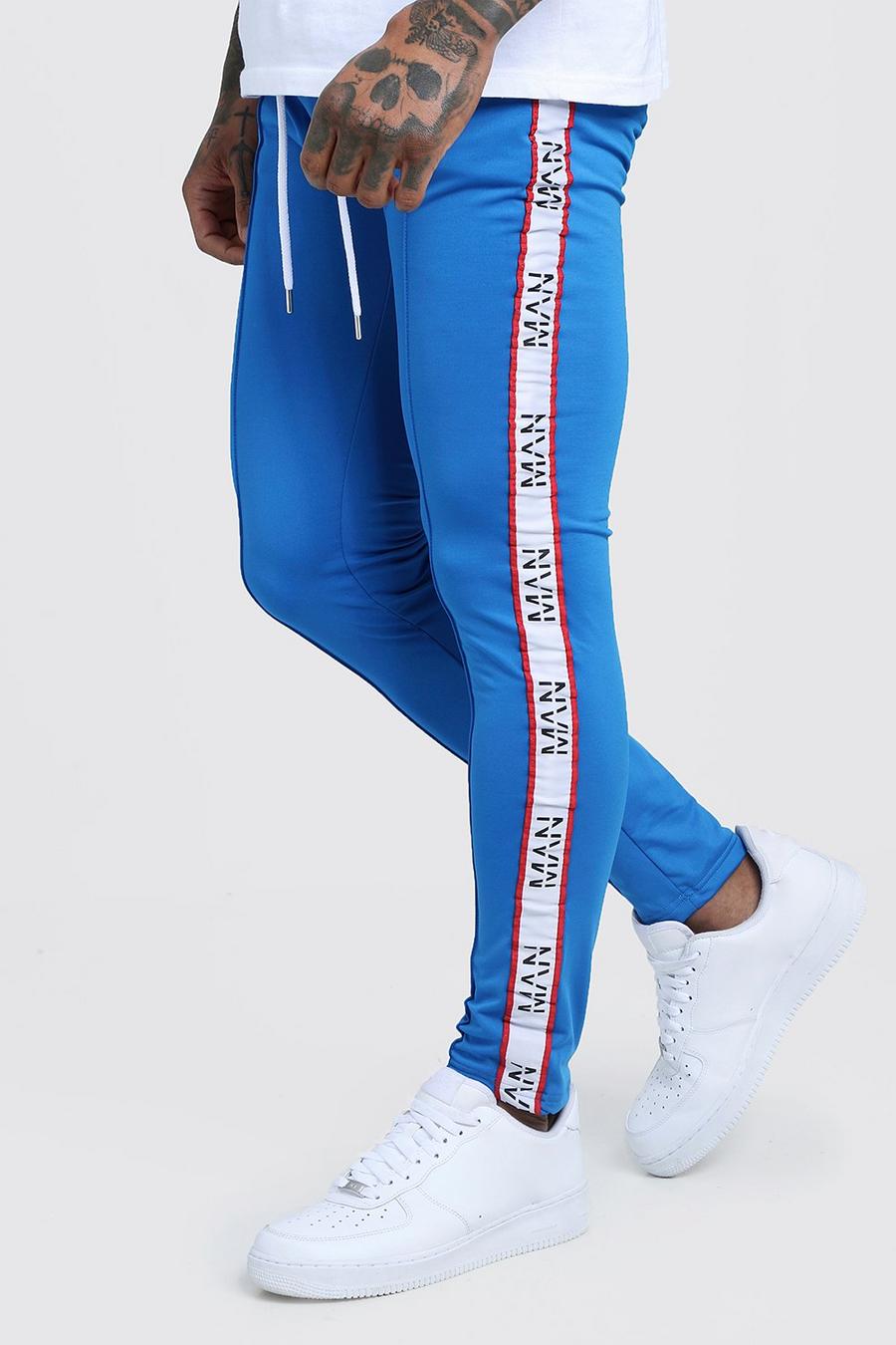 Skinny Fit Tricot Joggers With MAN Dash Tape image number 1