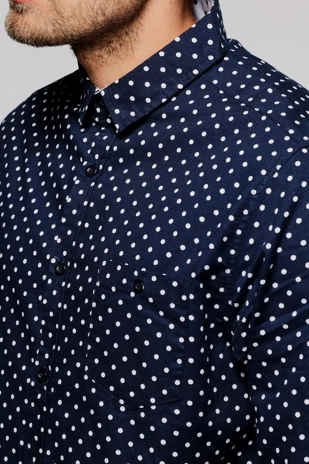 navy blue dress shirt with white polka dots