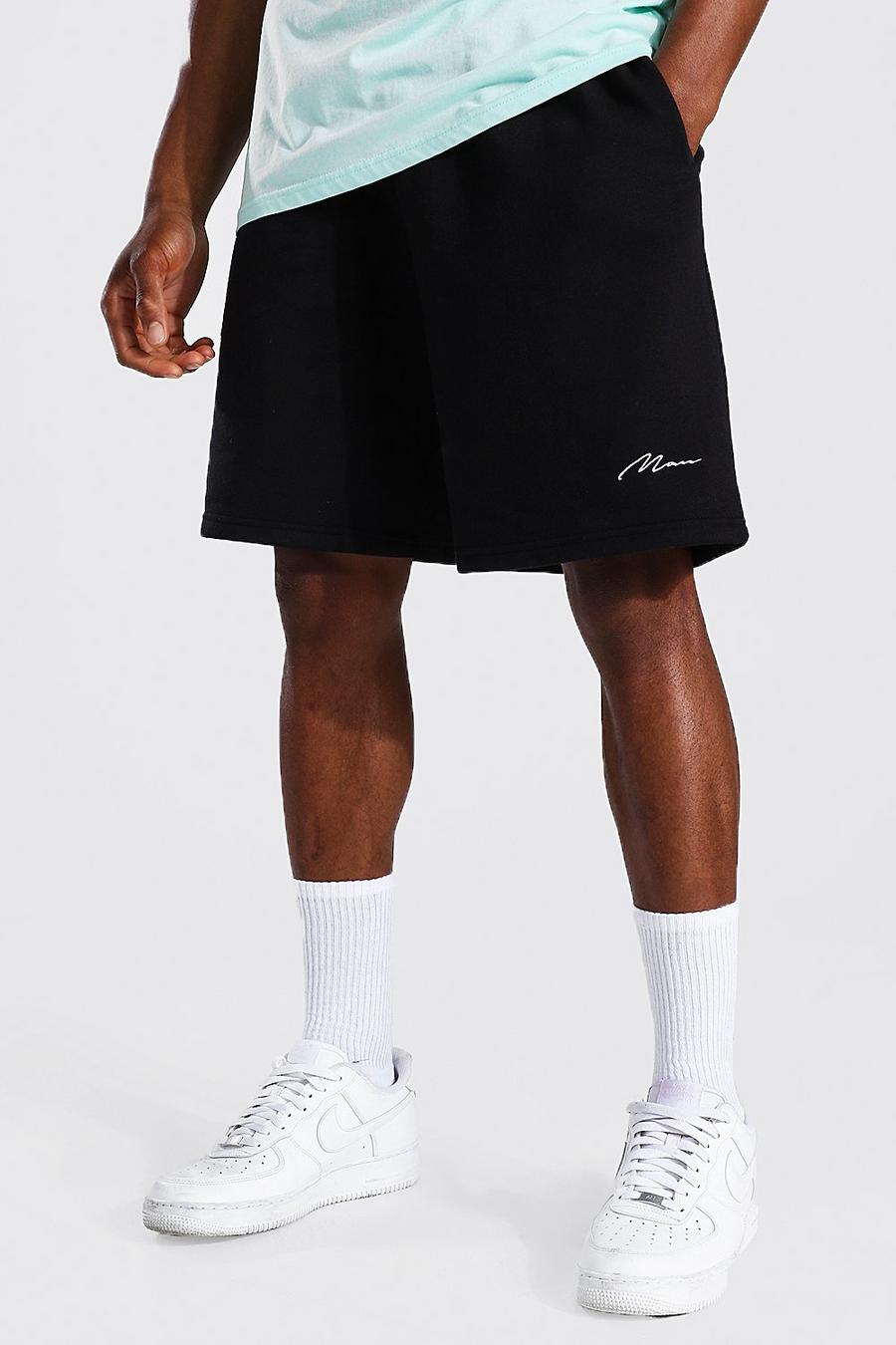 Pantaloncini in jersey con firma Man, taglio comodo, Black image number 1
