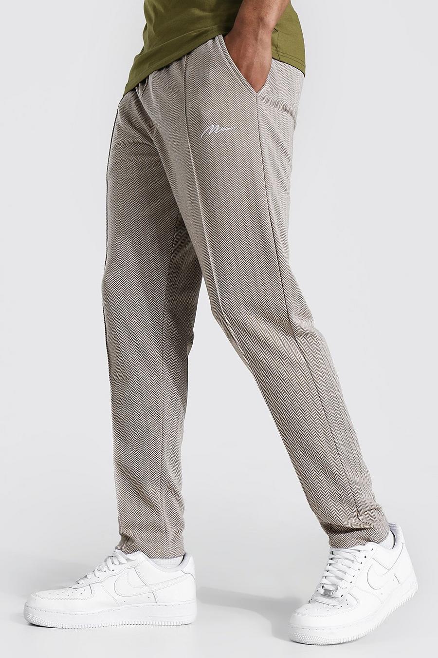 Pantaloni tuta slim in jacquard con nervature e firma MAN, Pietra image number 1