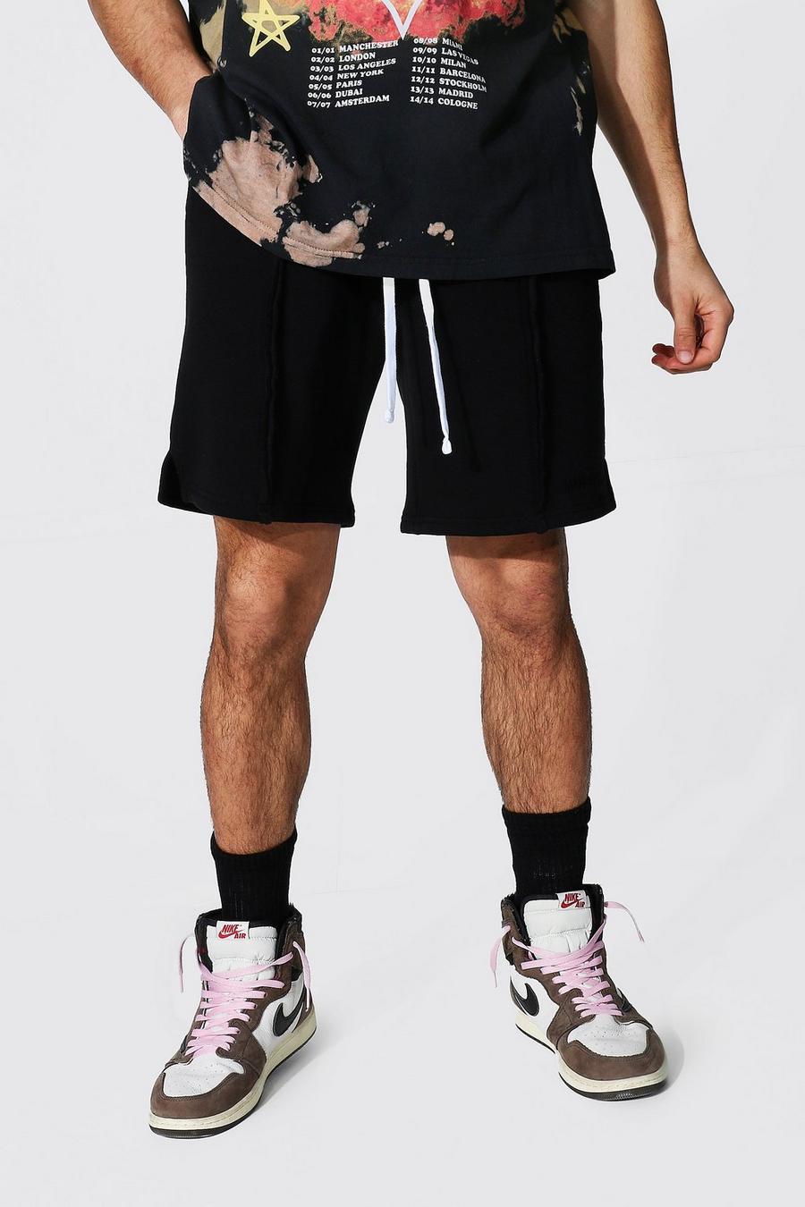 Loose Fit Jersey-Shorts mit geteiltem Saum und Man Official-Print, Schwarz image number 1