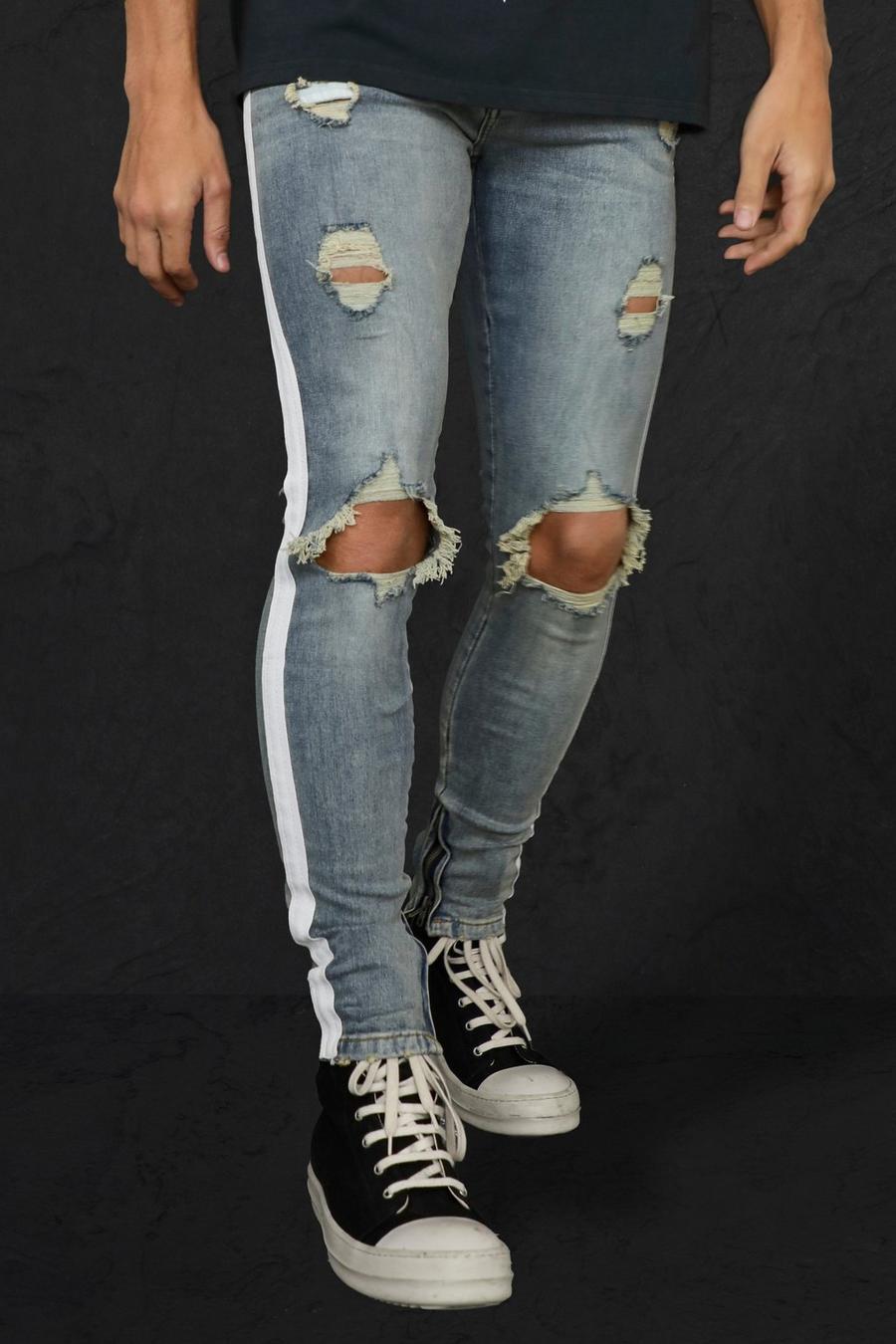 כחול עתיק סקיני ג'ינס סטרץ' עם פסים וקרעים גדולים בברך image number 1