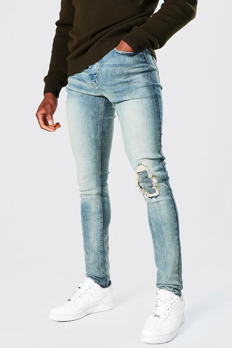Jeans skinny stretti in fondo con strappi alle ginocchia, Blu antico image number 1