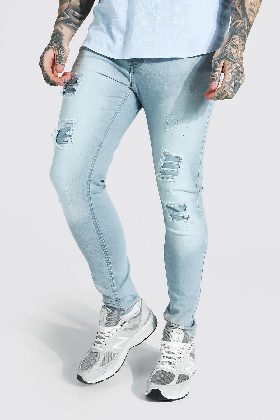 Jeans skinny elasticizzati con strappi e rattoppi, Grigio ghiaccio