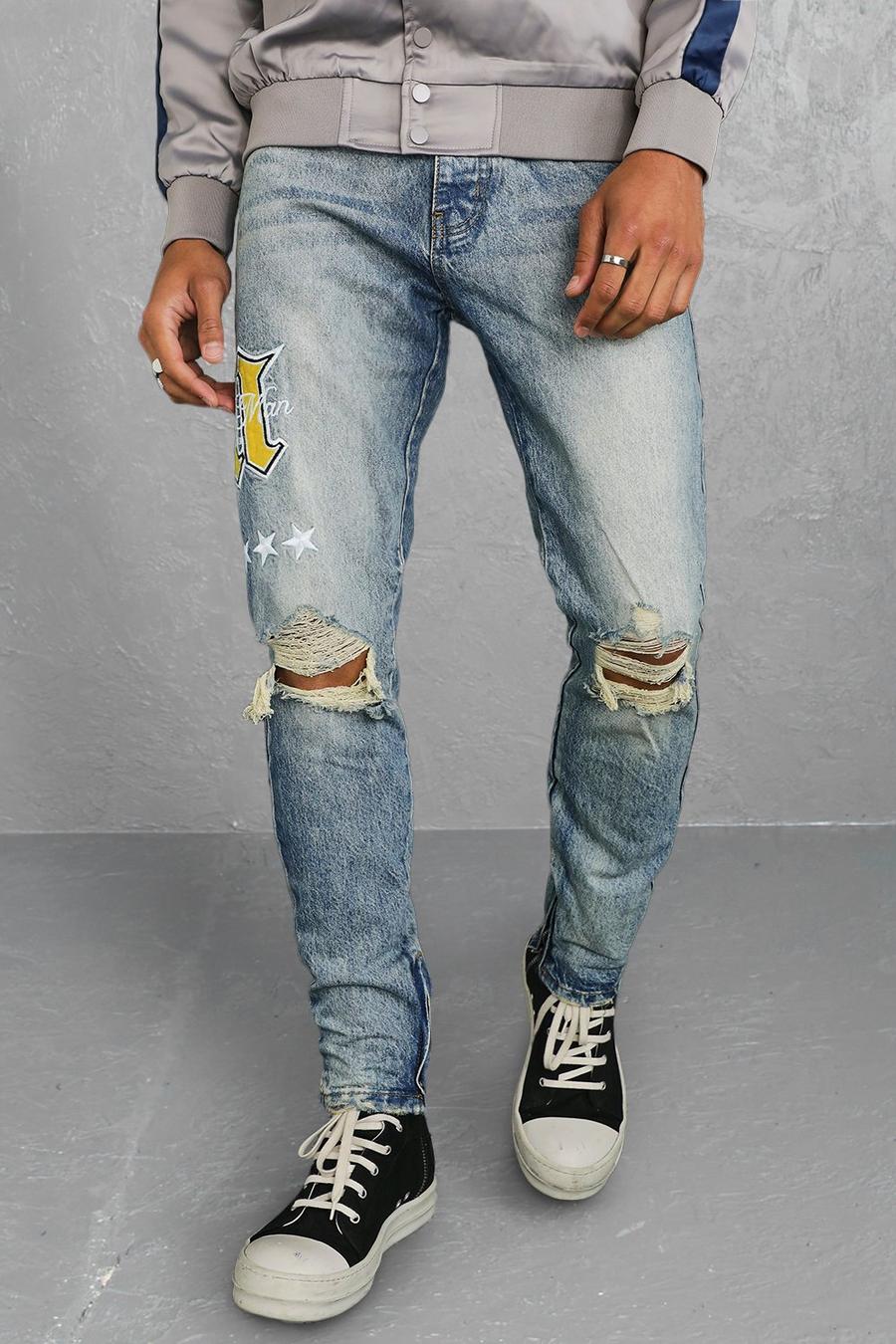 Skinny Jeans mit Riss am Knie und M-Aufnäher, Antikes blau image number 1