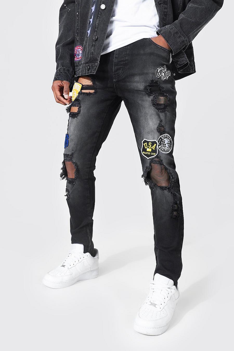 שחור דהוי סקיני ג'ינס סטרץ׳ בסגנון נבחרת ספורט עם קרעים בברכיים image number 1