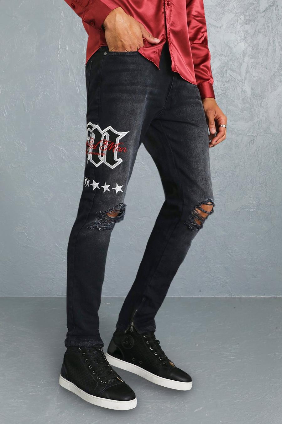 שחור דהוי סקיני ג'ינס קשיח בסגנון נבחרת ספורט עם טלאי M וקרעים בברכיים image number 1