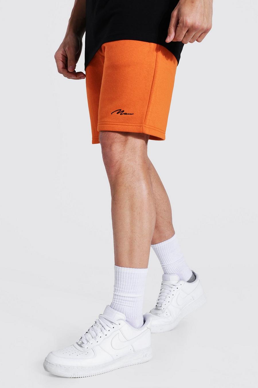 Pantaloncini in jersey di media lunghezza a vestibilità regular con firma Man, Arancio image number 1