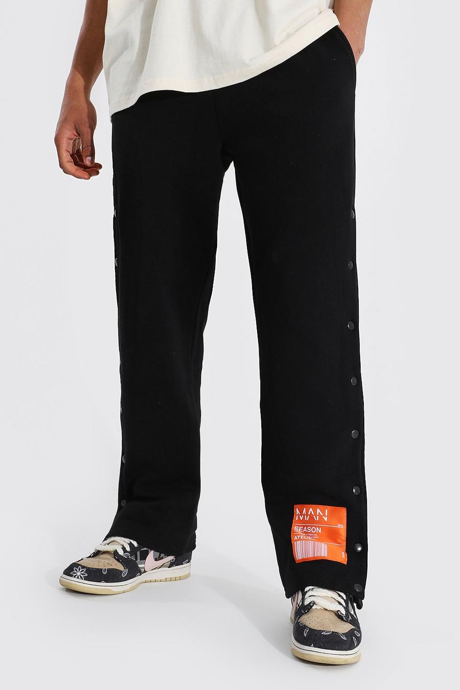 Pantalón deportivo MAN Original de pernera ancha con botones de presión, Black image number 1