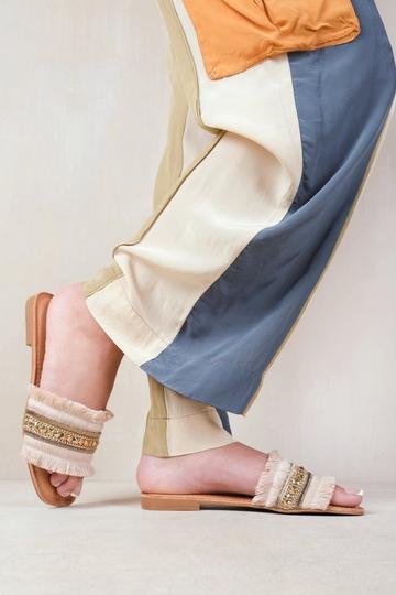 Beige 'Astroid' Flat Sandals With Fringe Trim And Stud Details