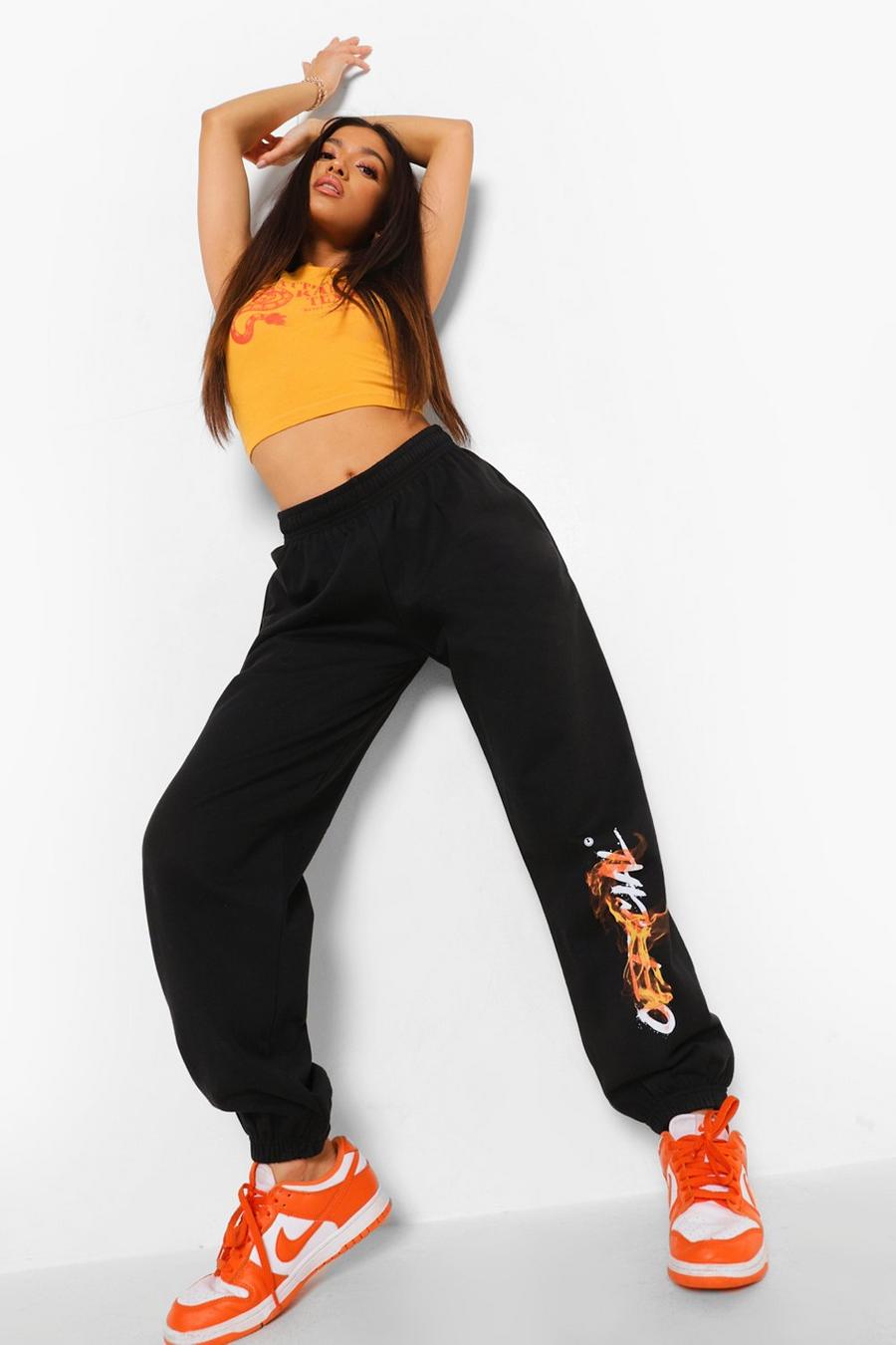 Pantalones de deporte anchos con estampado de llama Official Petite, Negro image number 1