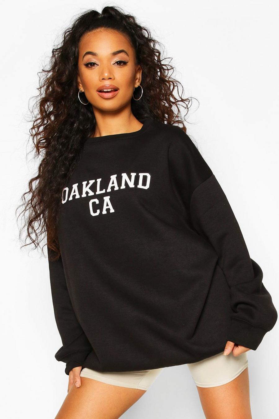 Petite Pullover in Übergröße mit „Oakland“-Slogan, Schwarz image number 1