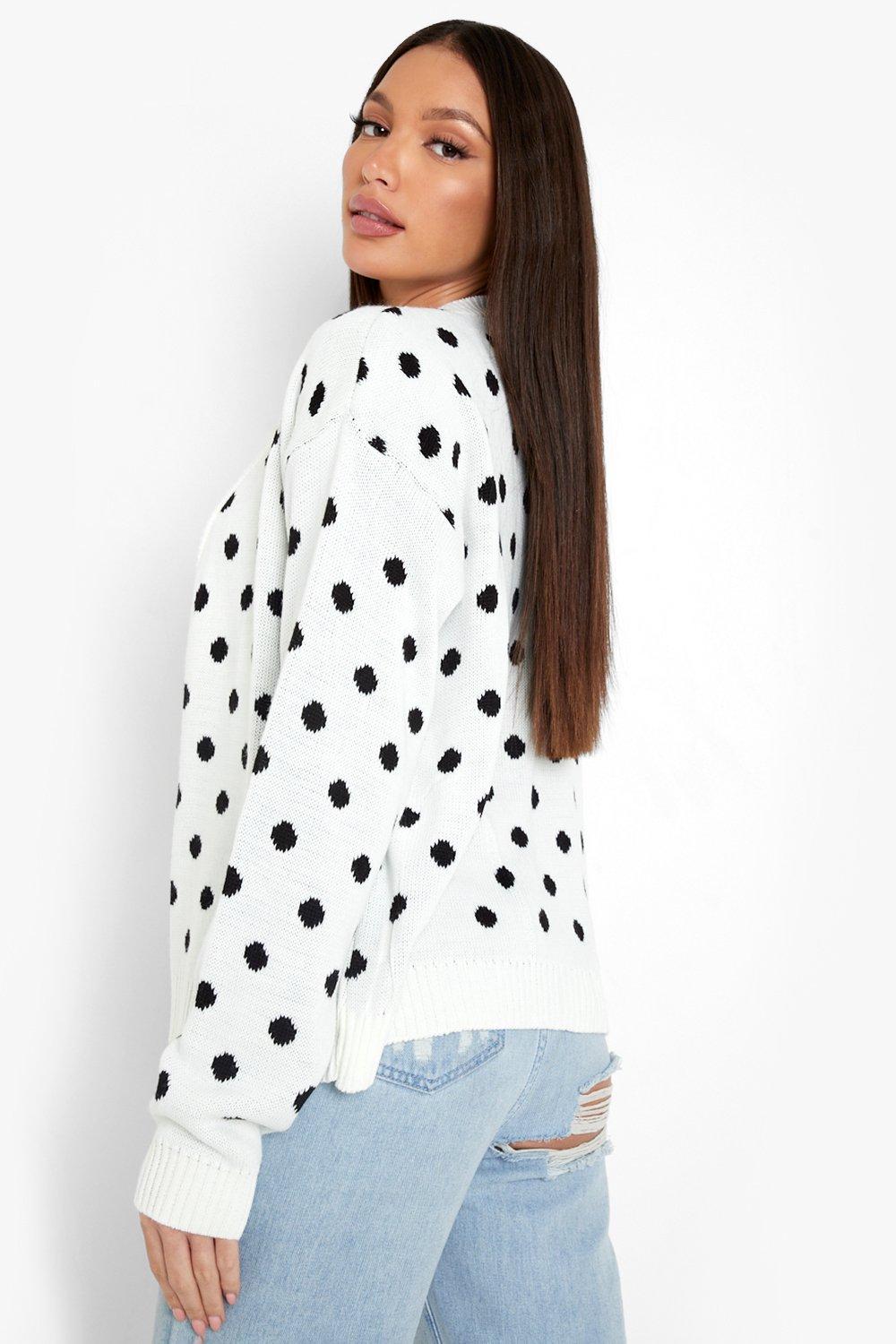 White cardigan with store black polka dots